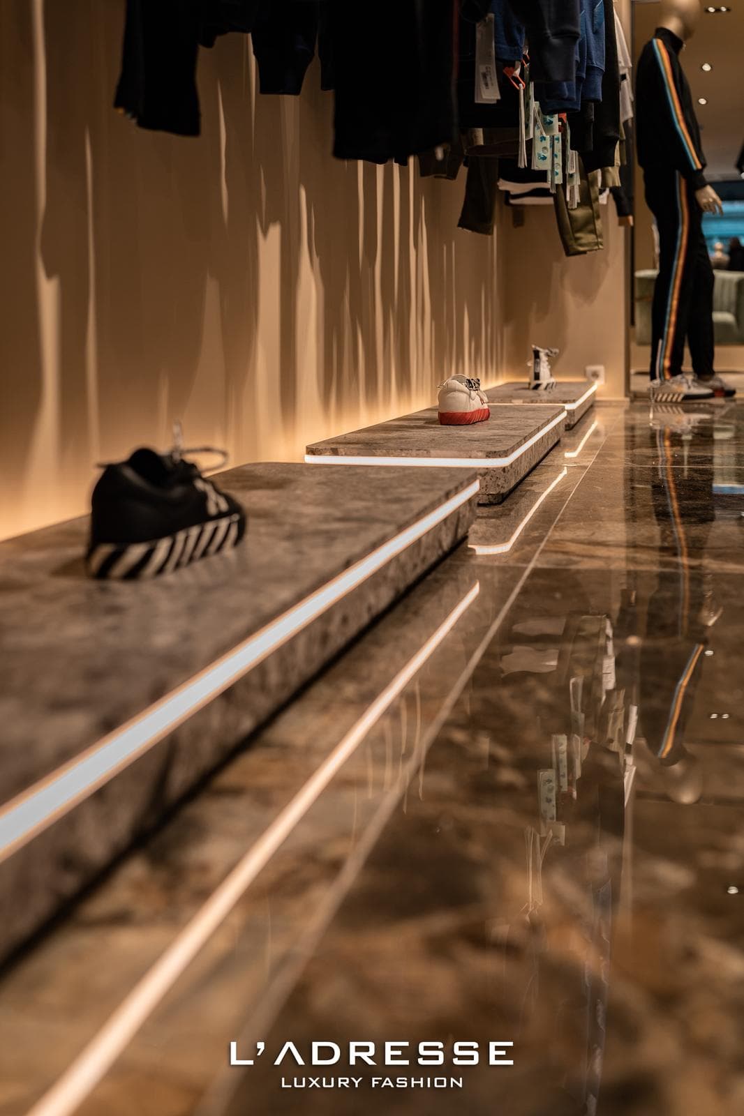 Sneakers on illuminated marble plinths