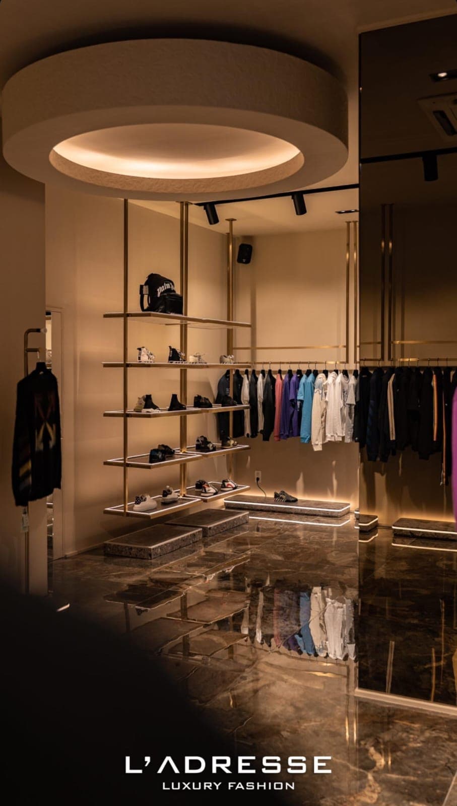 Halo-lit interior with brass shelving